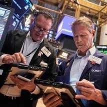 Traders Edward Curran, left, and Robert Charmak work on the floor of the New York Stock Exchange, Wednesday, Sept. 17, 2025. (AP Photo/Richard Drew)
