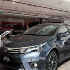 A Corolla Altis sedan stands on display at a Toyota Motor Corp. dealership in Singapore, on Tuesday, July 12, 2016. Buyers in one of the world's most expensive car markets just missed their chance to snag one at the cheapest price in five years. Car-ownership permit costs in Singapore have gained since February after ride-hailing companies obtained licenses for their fleets and the regulator eased rules on vehicle loans in May. Photographer: Ore Huiying/Bloomberg via Getty Images