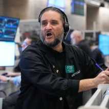 Options trader Chris Dattolo works on the floor of the New York Stock Exchange.