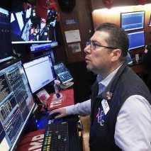 Trader Michael Capolino works on the floor of the New York Stock Exchange, Monday, Nov. 24, 2025.