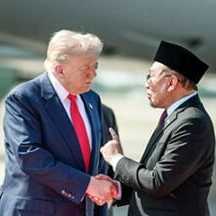 Donald Trump and Anwar Ibrahim shaking hands