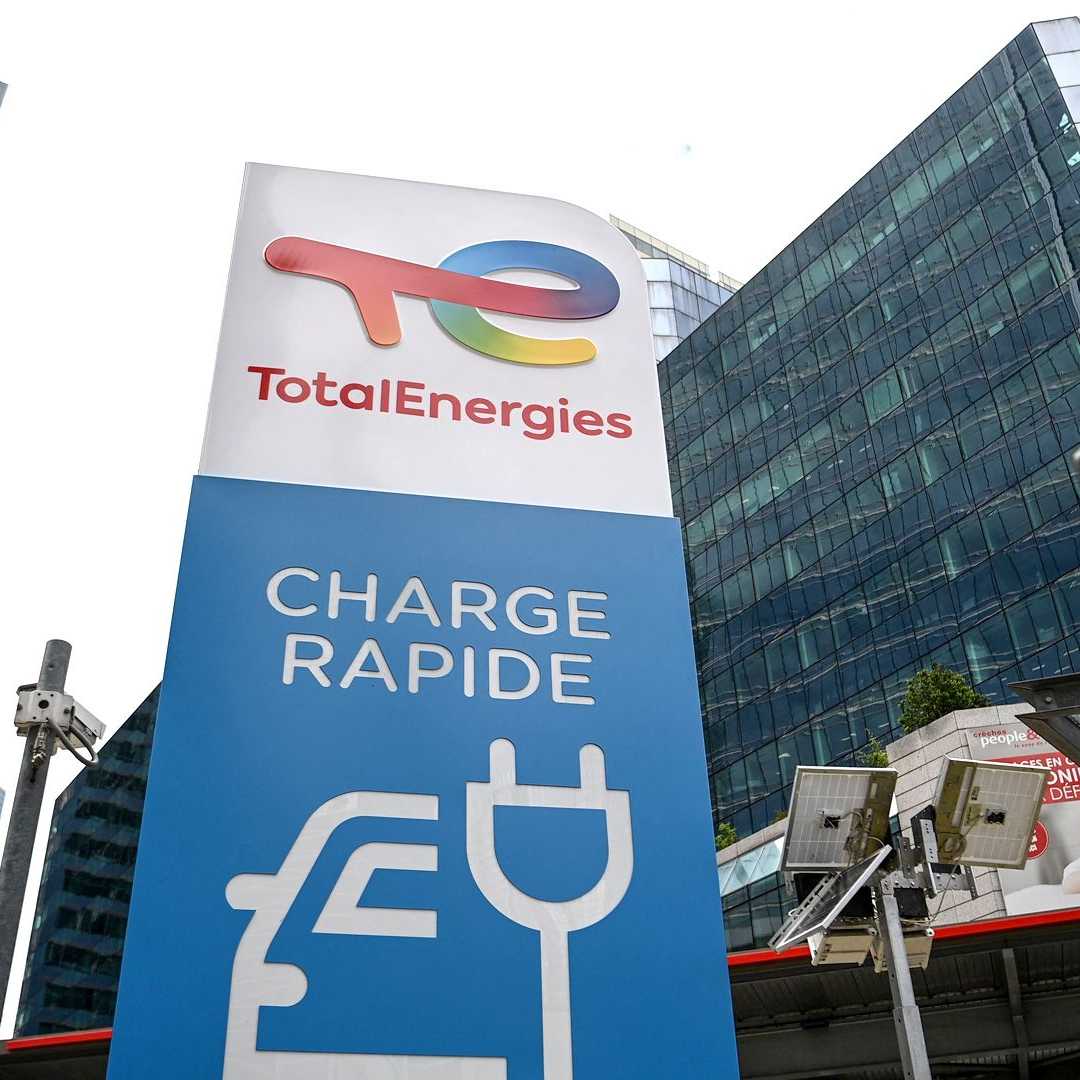 TotalEnergies logo with an electric chargepoint image.